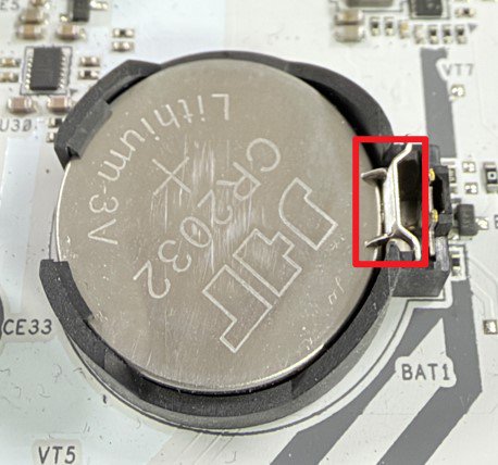 Push the latch to the side to release the battery.